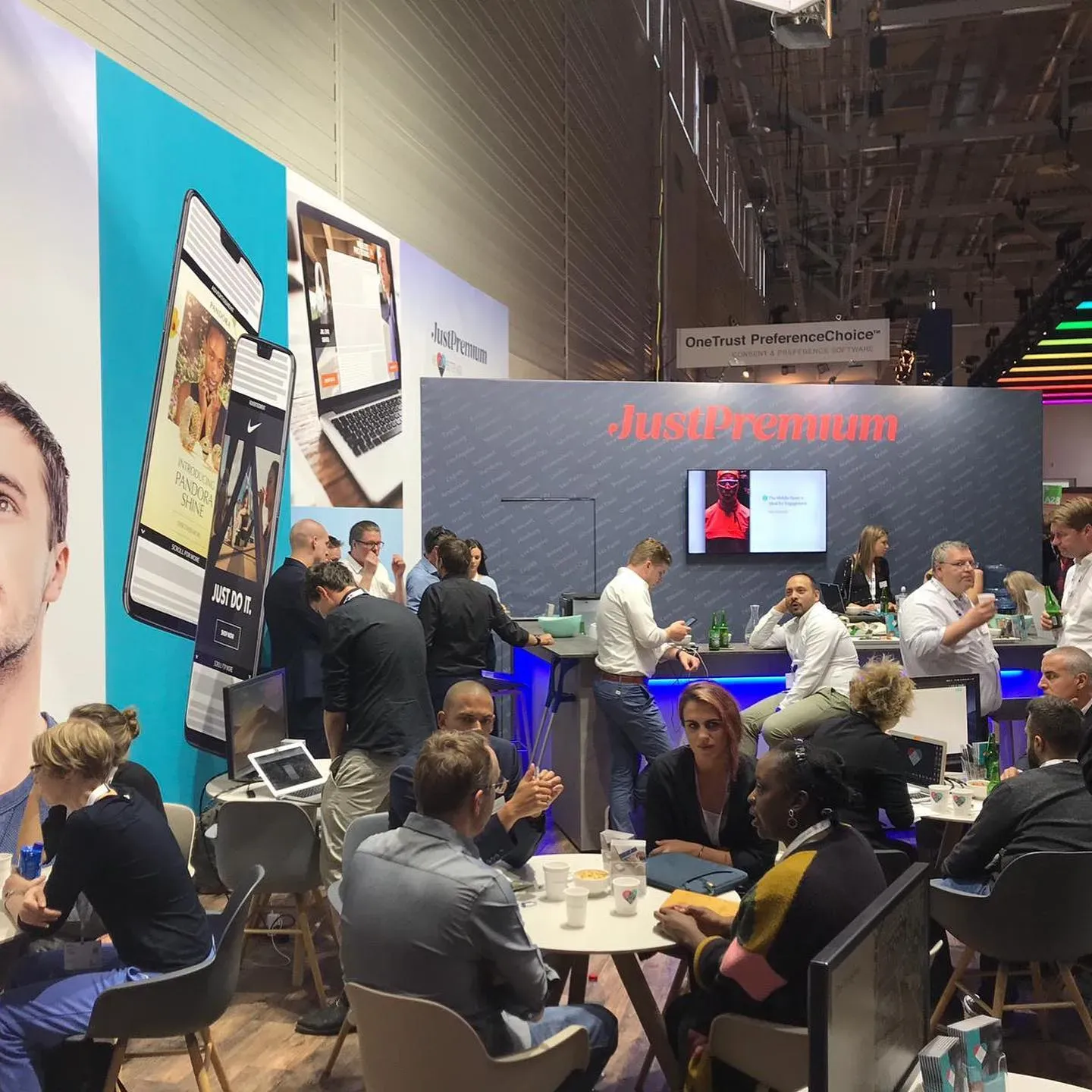 Photo from event, taken in booth showing the busy space and bar